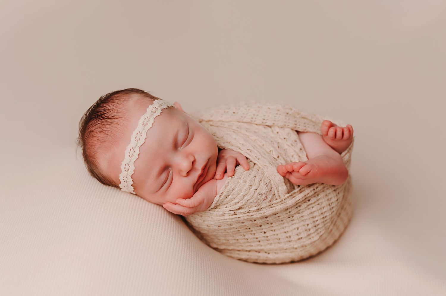 Newborn Bundled in a wrap