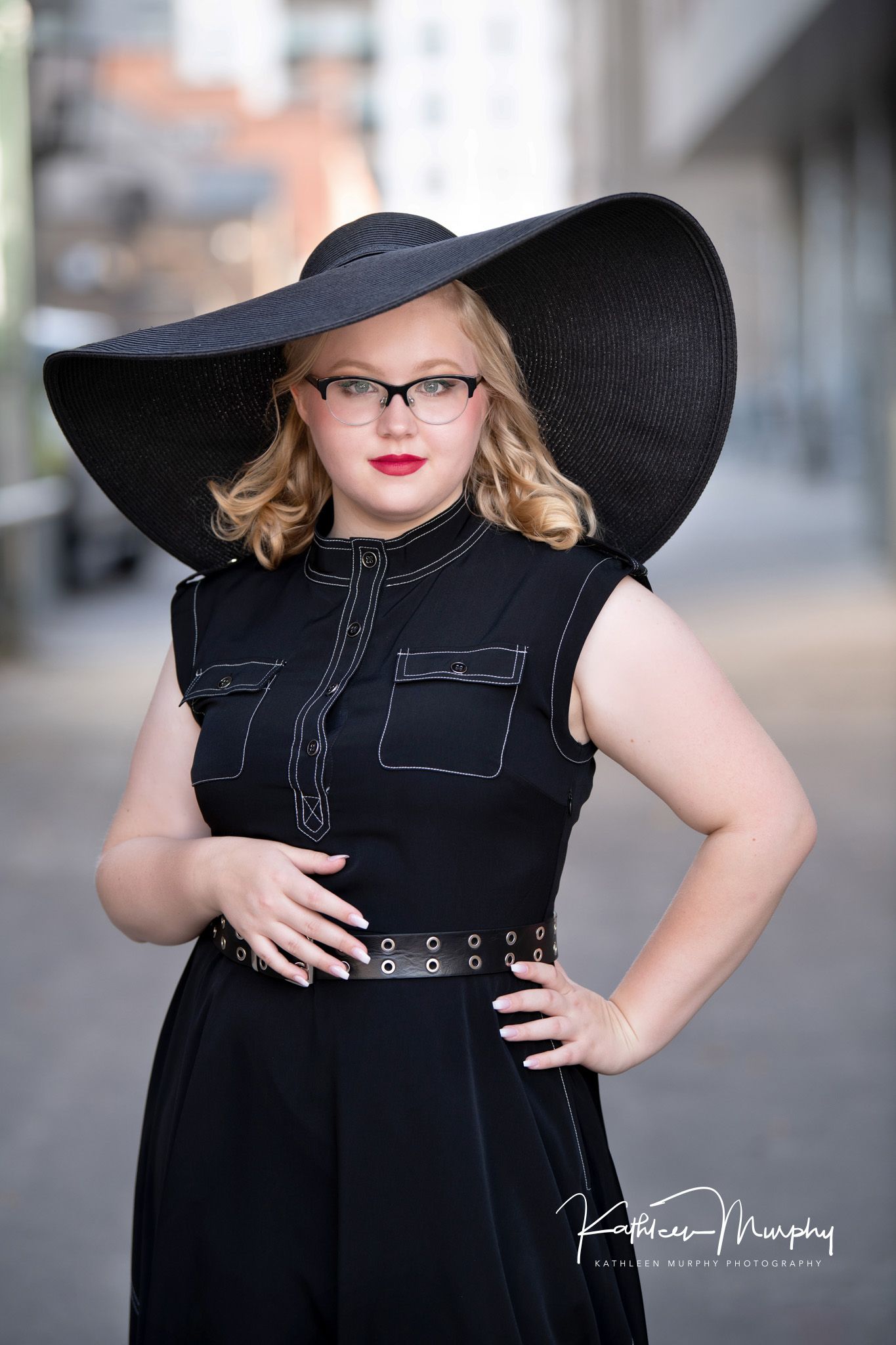 Kathleen Murphy Photography picture of young woman in a black dress with floppy black hat