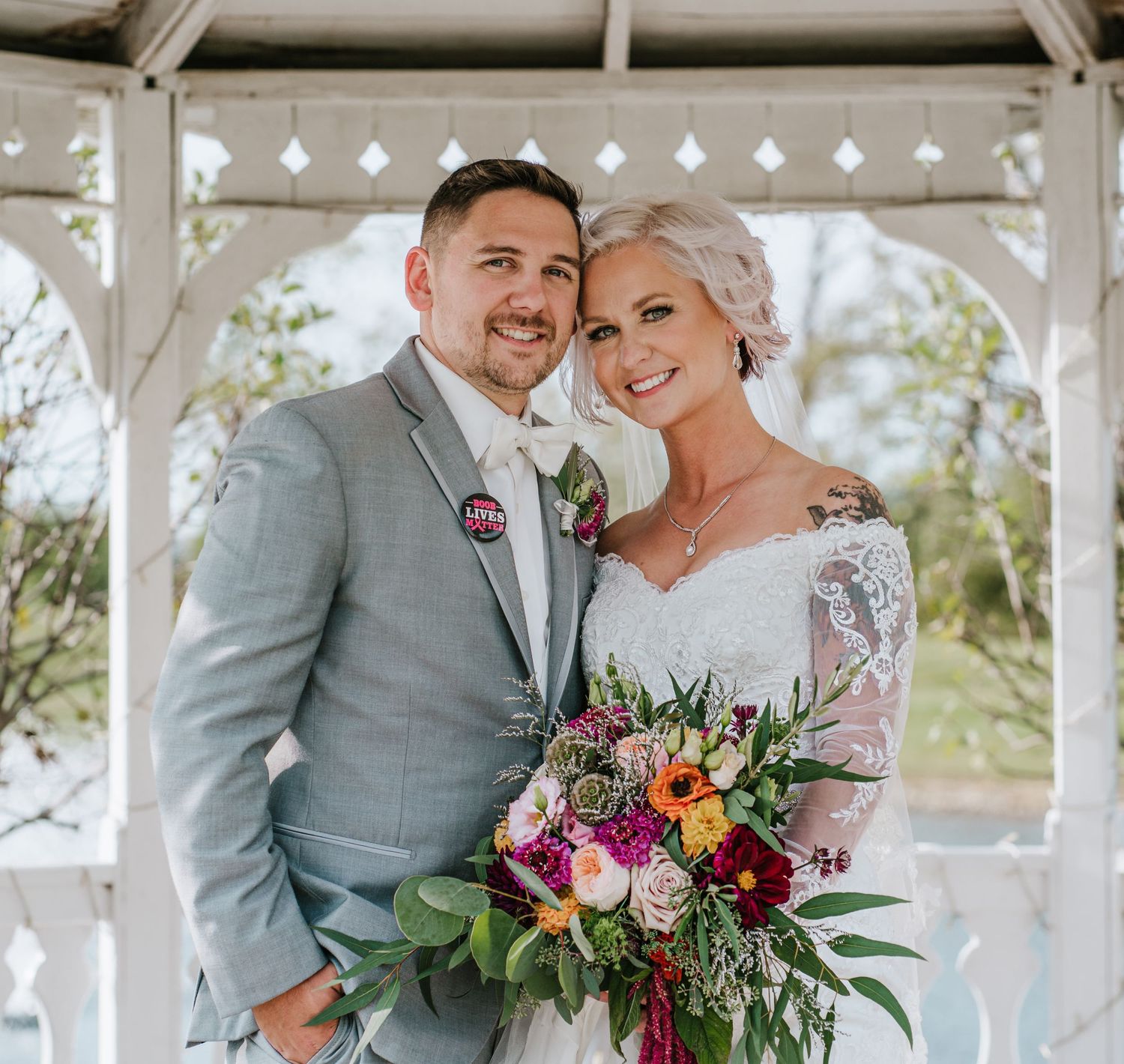 bride and groom in gazebo