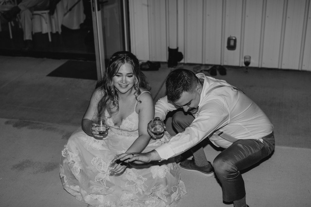 Black and white of Bride and groom dancing during reception