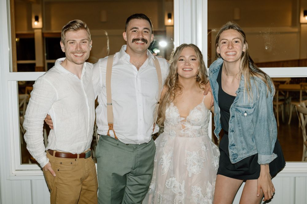 Bride and groom with Austin and Sierra during the ceremony