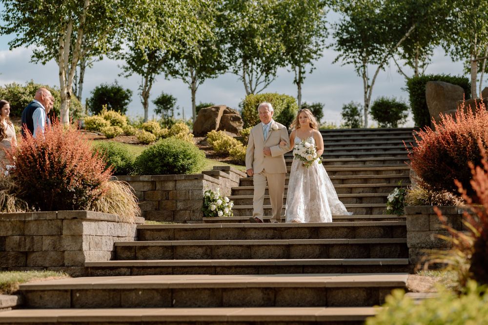 Bride and her Father descending staircase to wedding ceremony