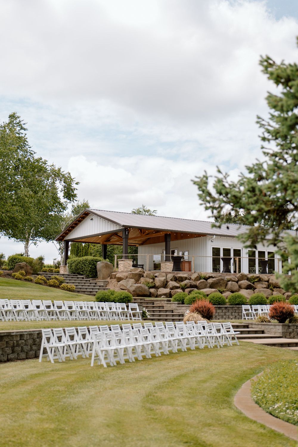 White chairs set up for wedding ceremony
