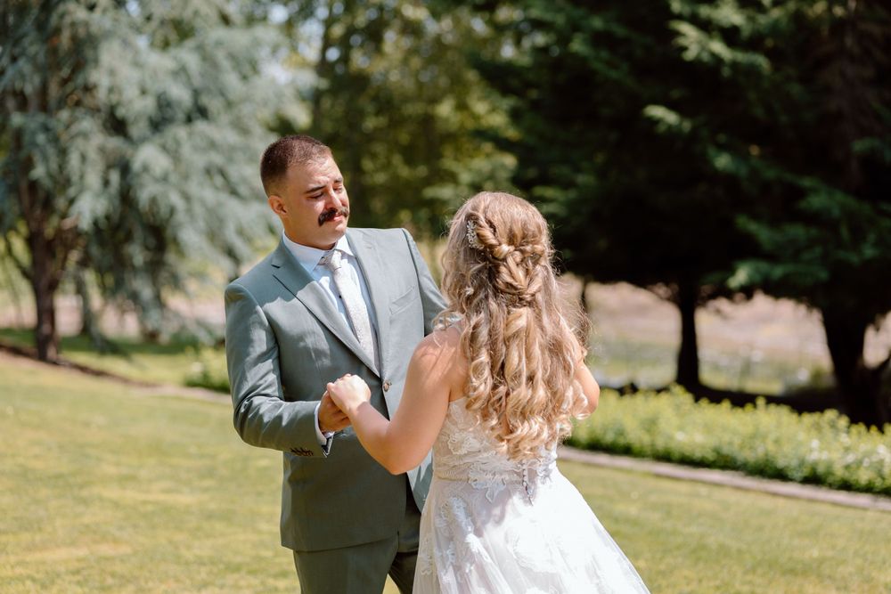 Bride and groom dancing at first look