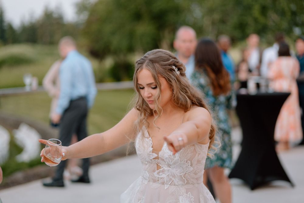 Bride dancing in the crowd during reception