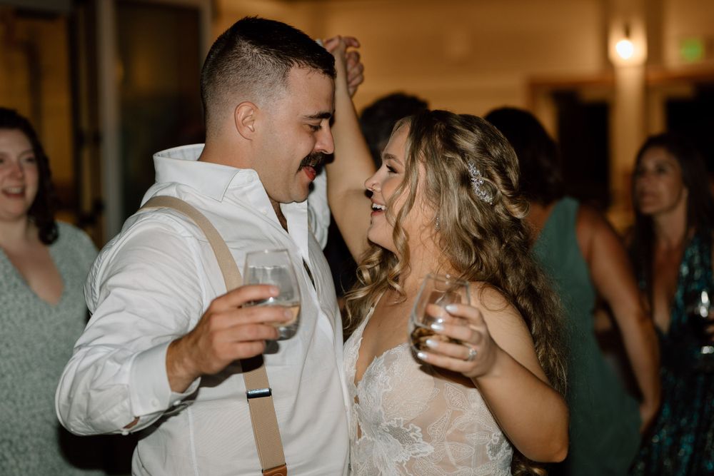 Bride and groom dancing with each other during receptions