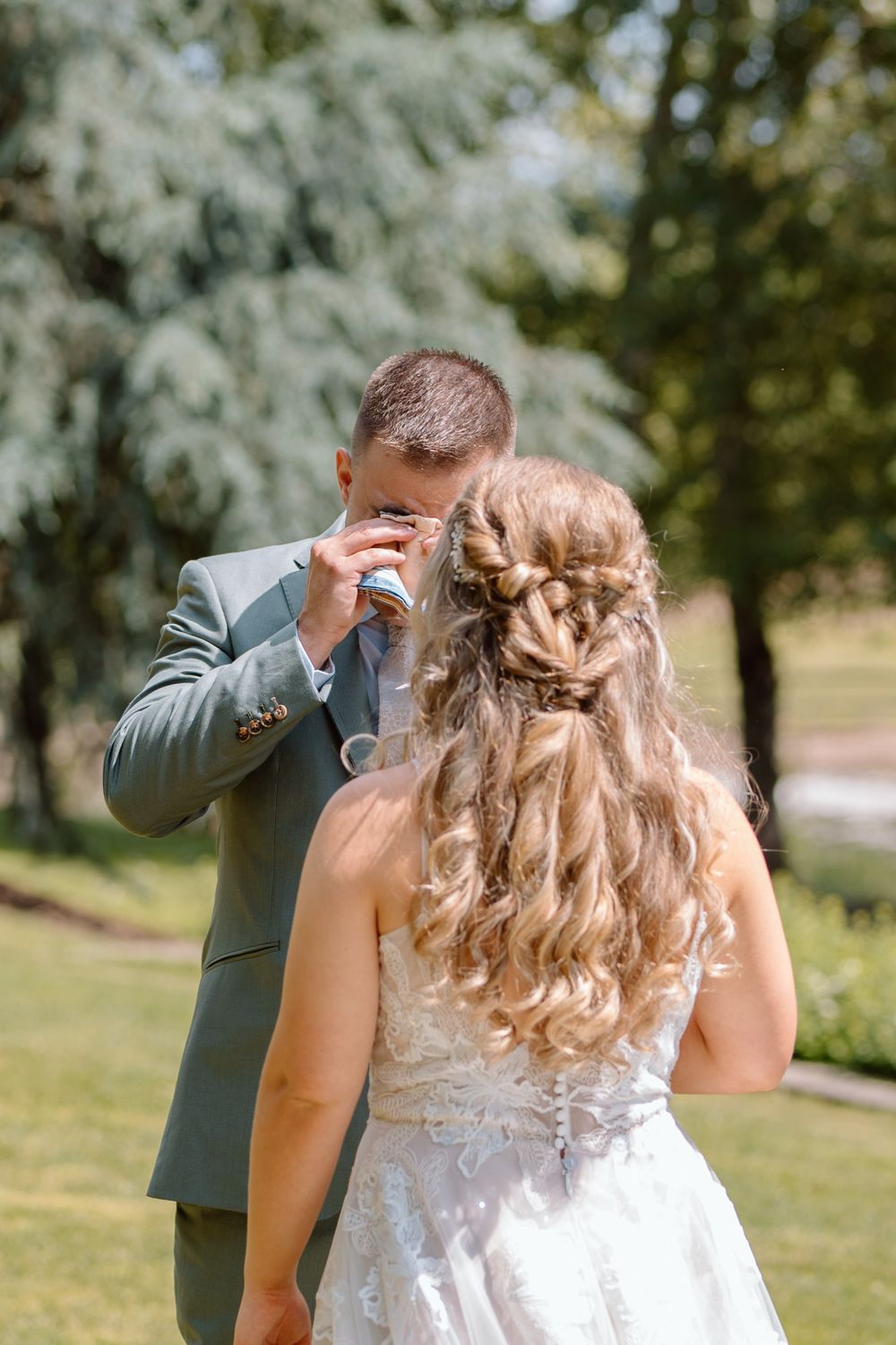 Groom crying with joy when seeing bride during first look