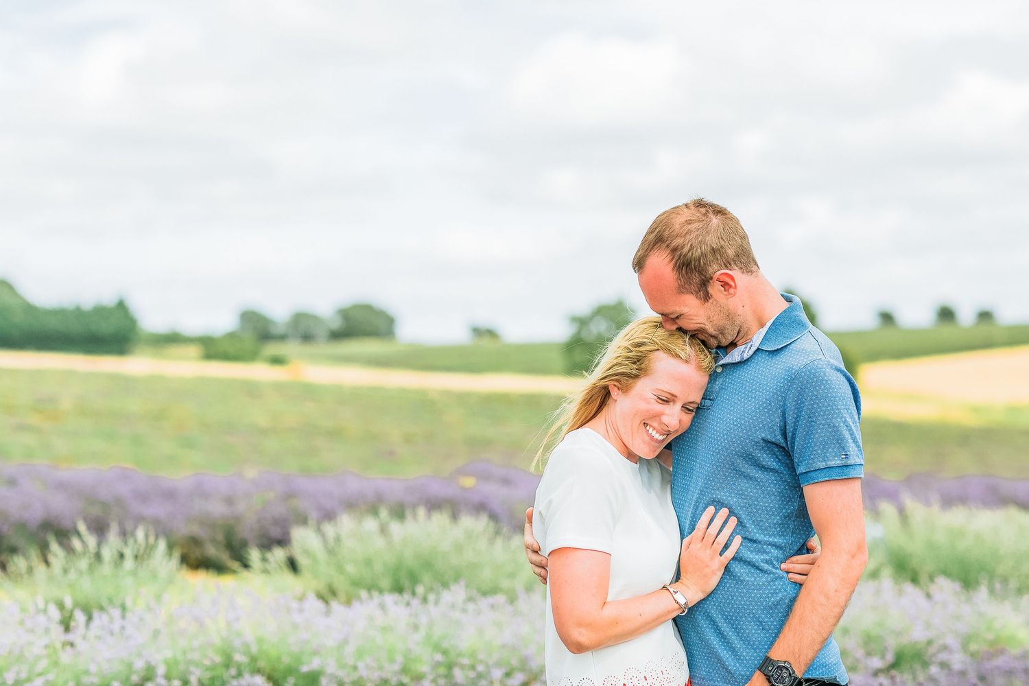 Hayley Elizabeth Photography Cotswolds Photographer Lavender engagement session Snowshill man kisses fiancé's head
