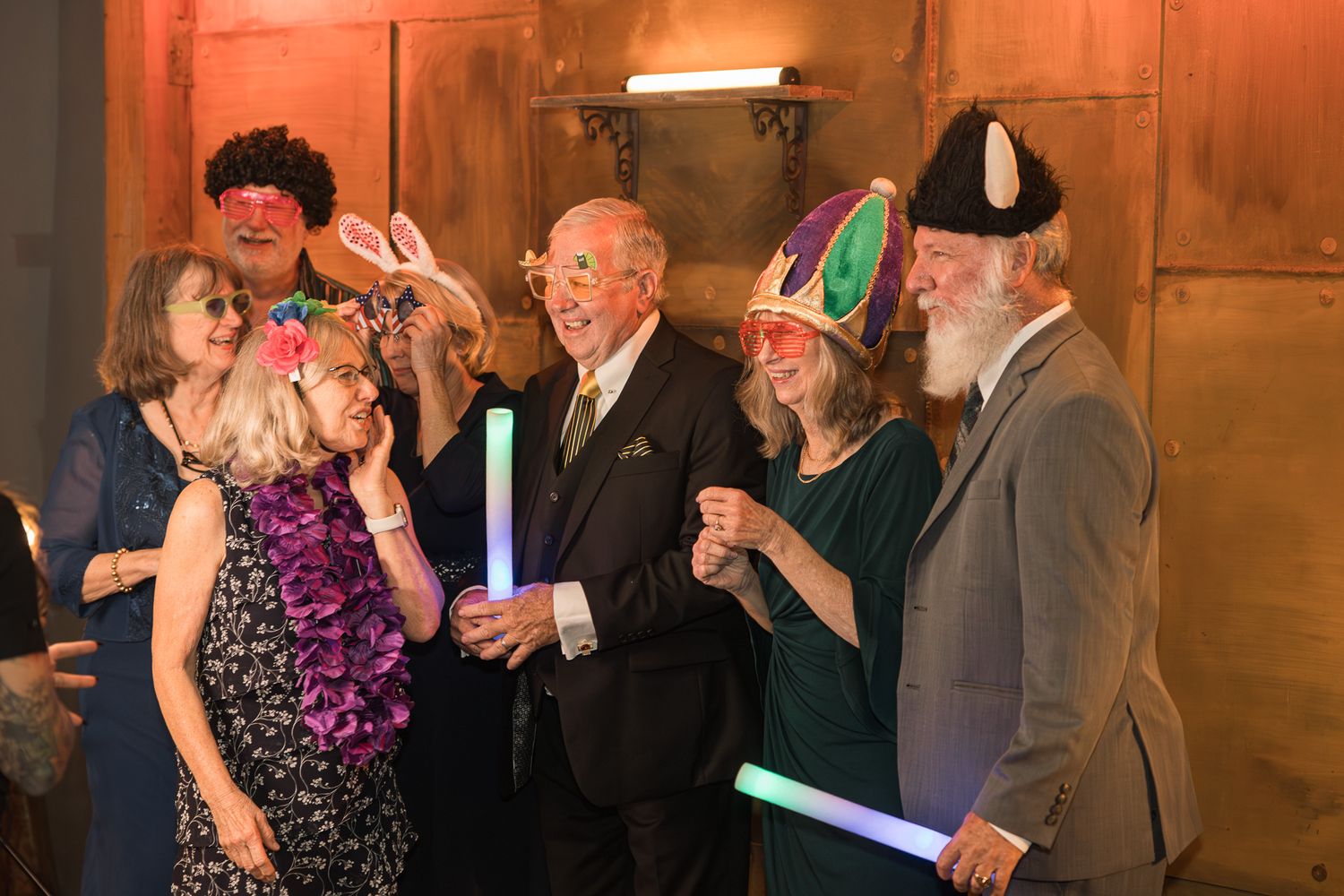 elder group of people wearing photo booth props