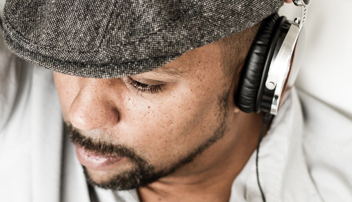 Close-up shots of person wearing headphones and glasses in studio setting.