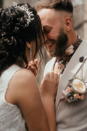 A lovely couple exchanging vows in a picturesque garden on their wedding day.