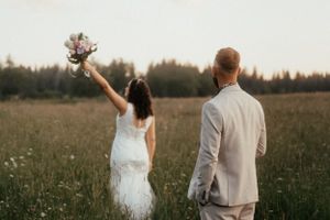 Lovely couple in the fields celebrating their wedding day