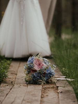 Beautiful bridal bouquet with a mix of roses, peonies, and greenery.