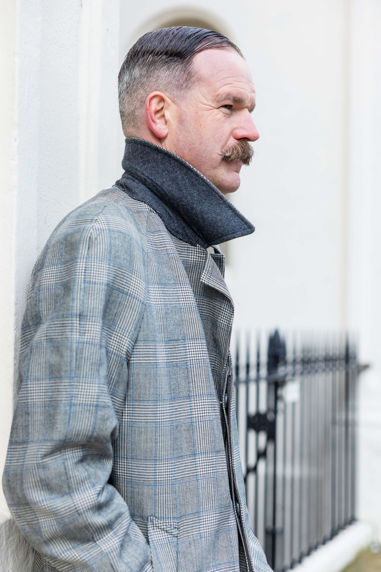 Side profile of Dan looking dapper with collar turned up for his headshot shoot in Hove