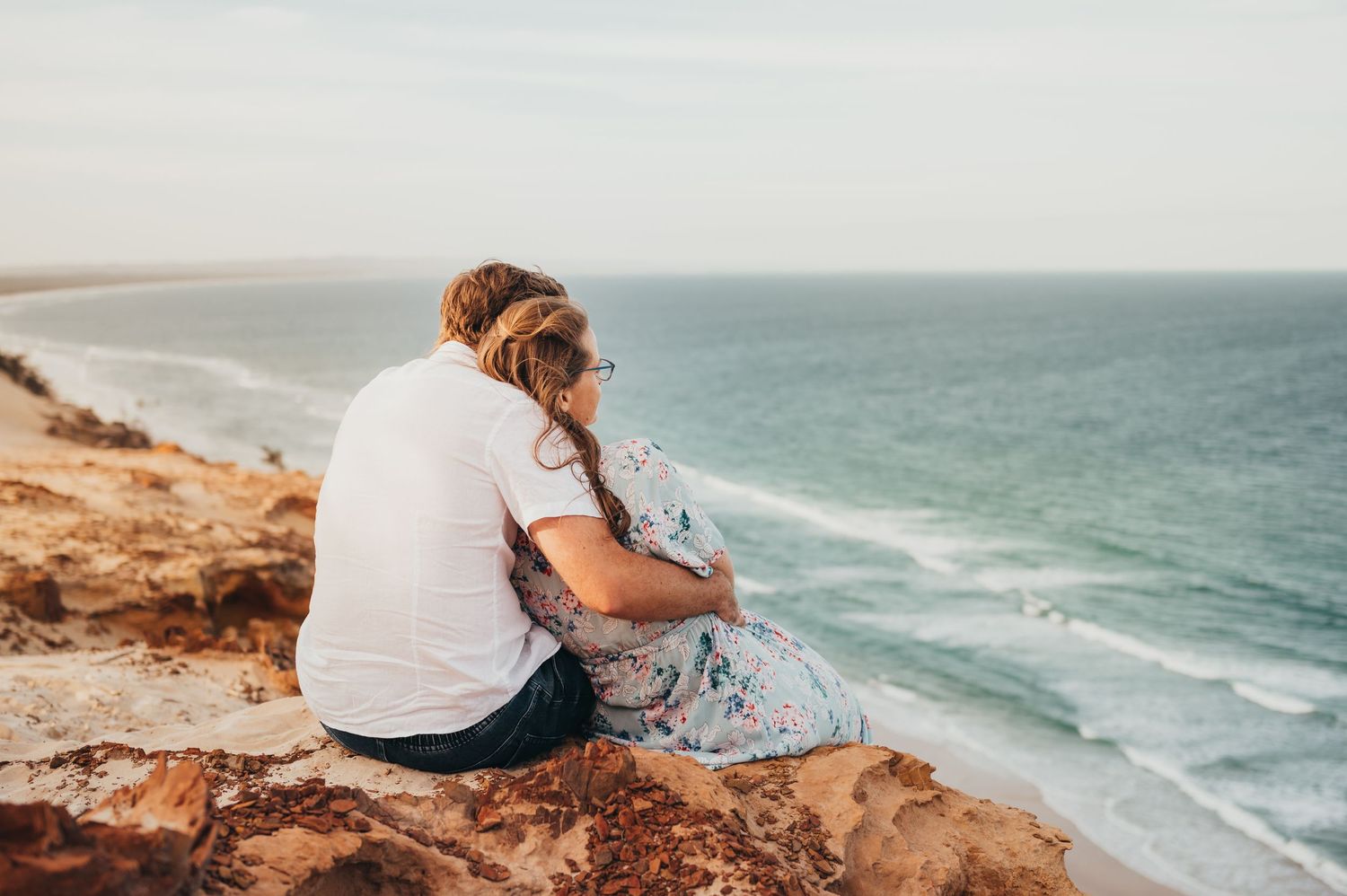 celebrating their love with an engagement session atop Carlo Sandblow, Queensland at Rainbow Beach, QLD