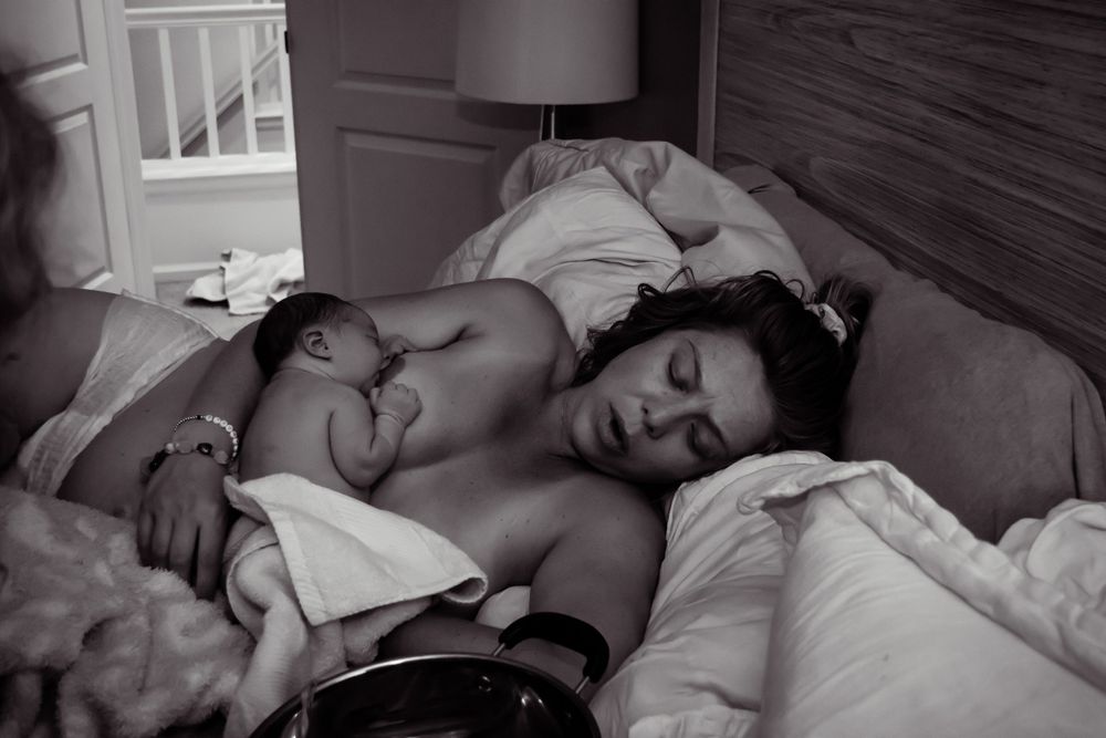 Intimate black and white photography documenting postpartum care.