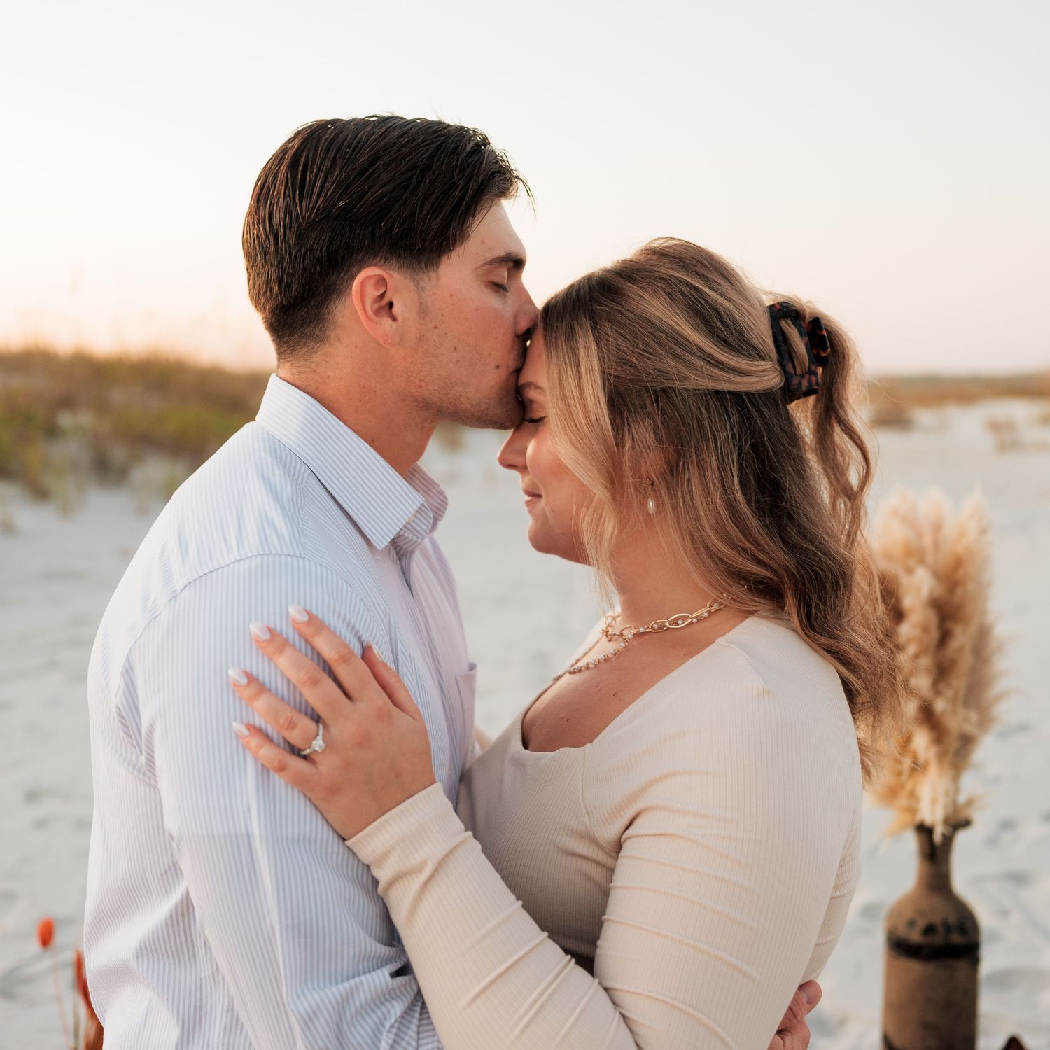 couples propose on the beach