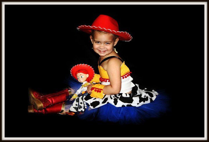 Toy Story themed photo with cowboy-style props and plush characters.