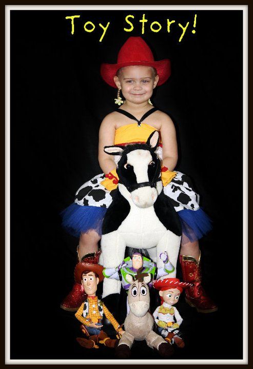 A collection of Toy Story plush toys and figures arranged against a black background.