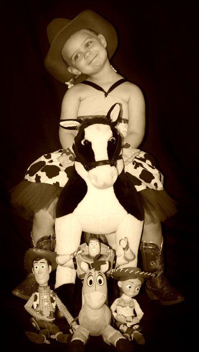 Sepia-toned photo of Toy Story characters arranged in a portrait style setting.