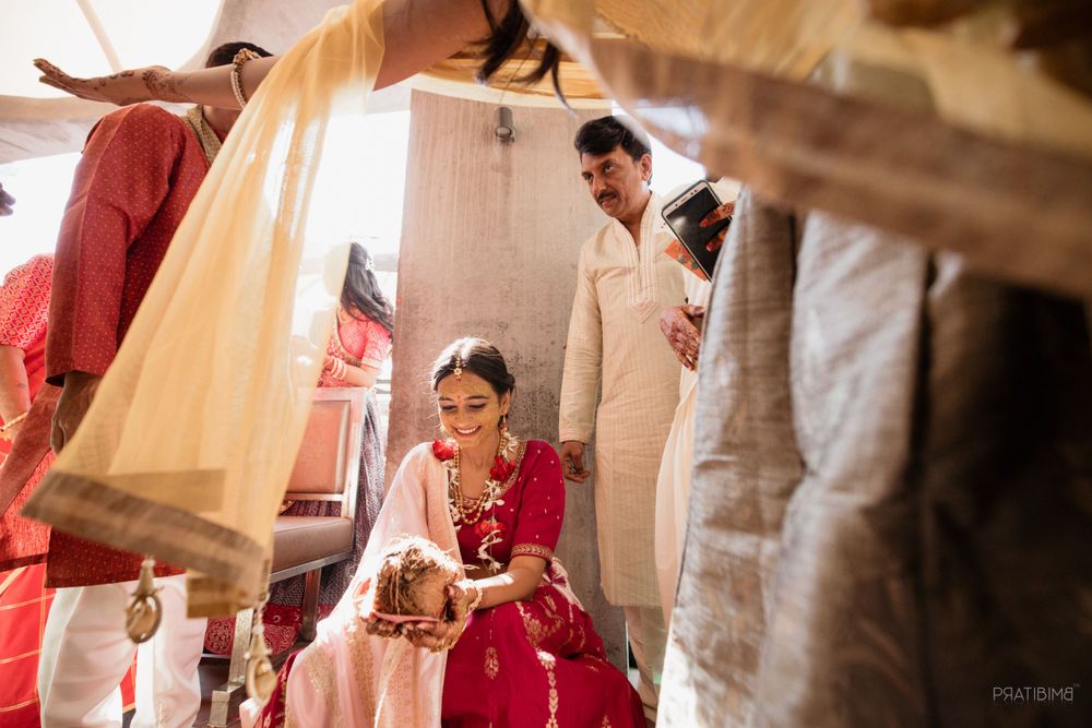 Wedding preparation scene with traditional Indian attire and decorations.