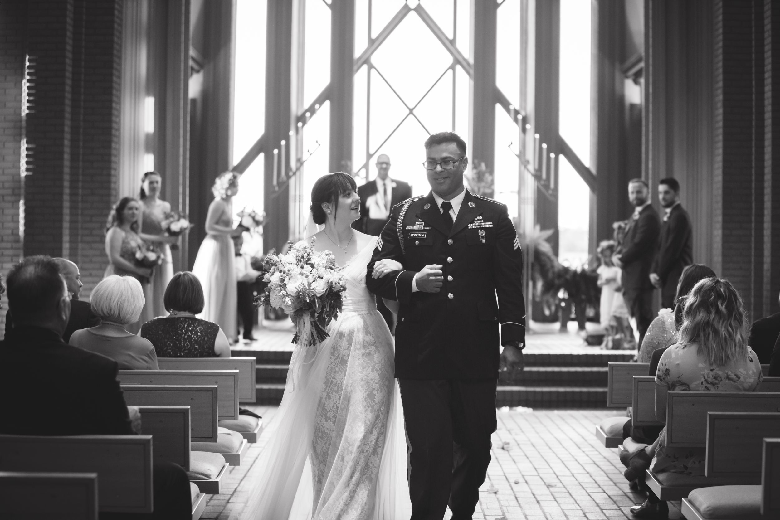 Black and white photos capturing intimate wedding ceremony moments in a beautiful chapel.