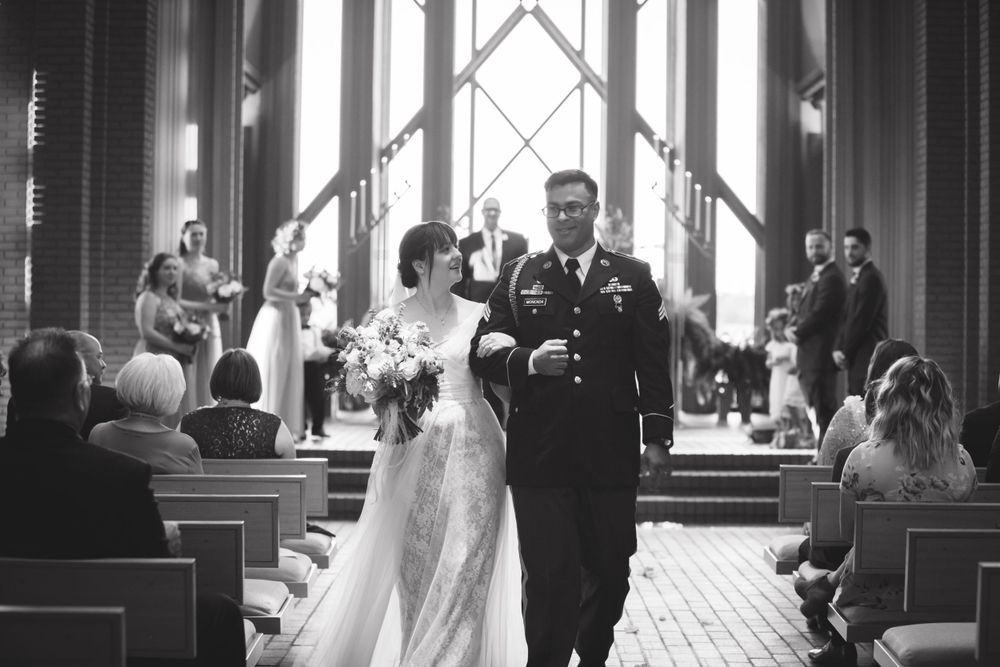 Black and white photos capturing intimate wedding ceremony moments in a beautiful chapel.