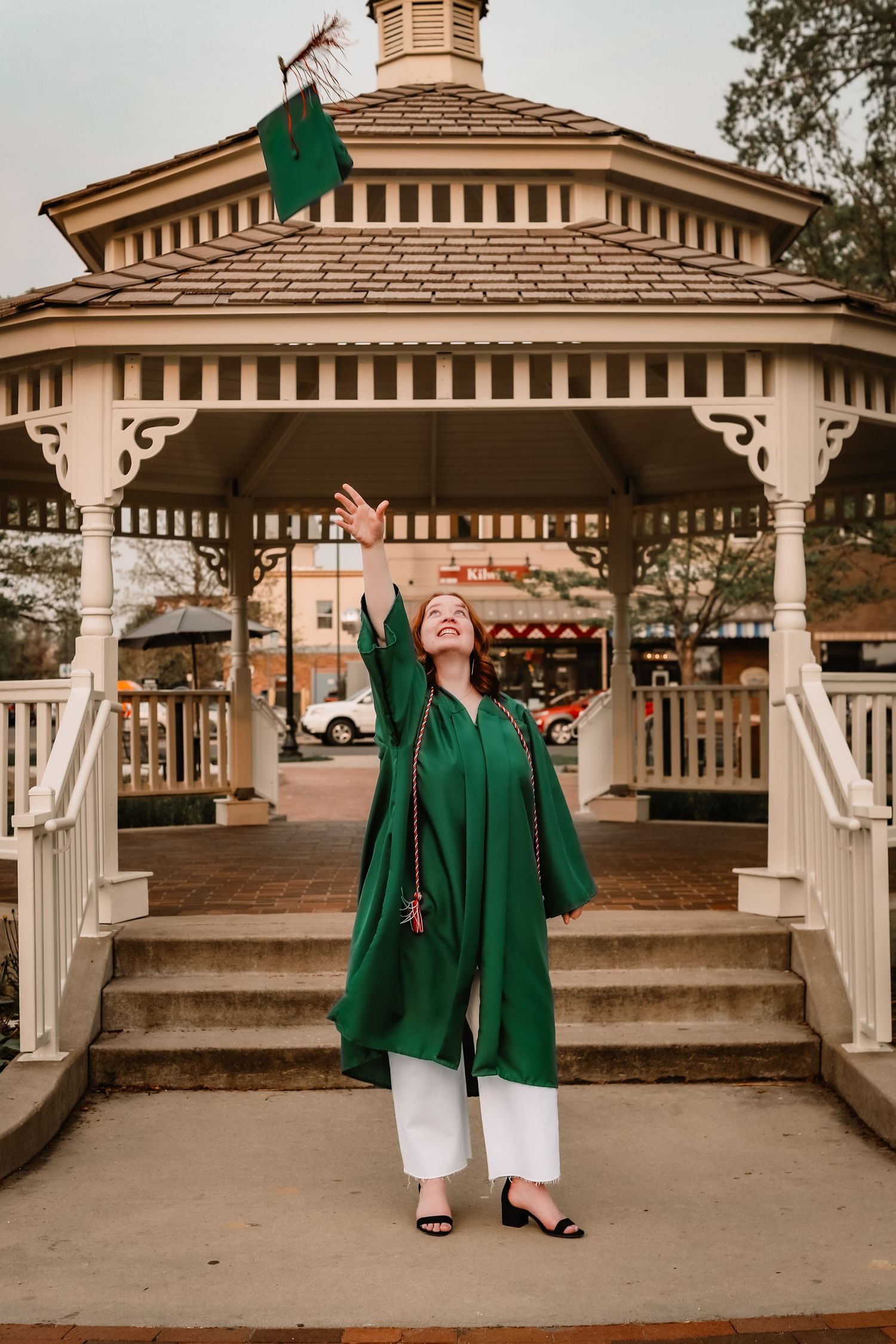Senior girl tossing graduation cap by Vine Photography in Salem Ohio