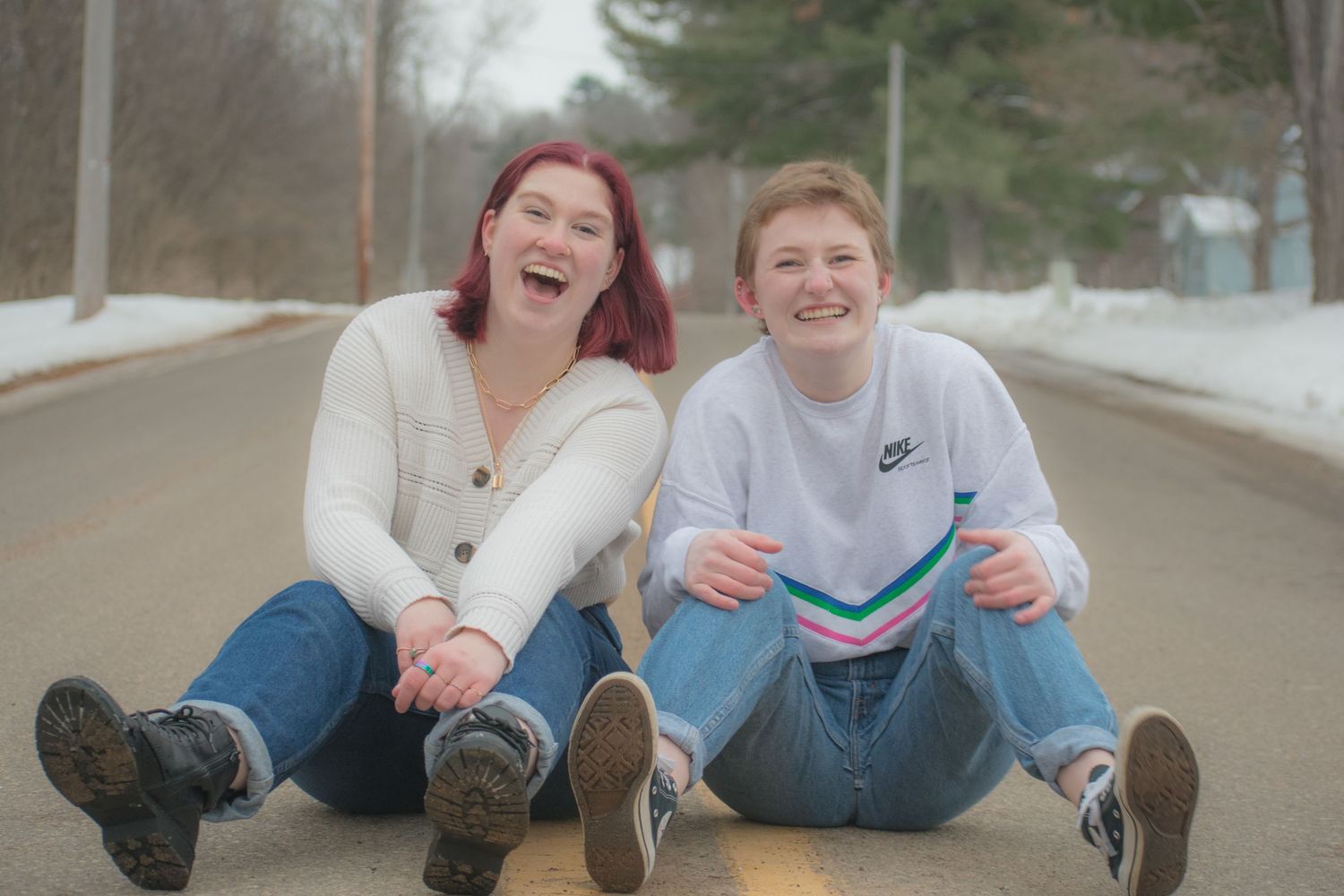 Portrait - Dannica and Erica sitting together on the street in Menomonie, Wisconsin