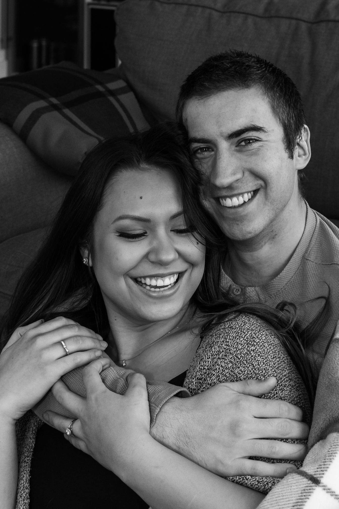 black and white photo, indoor couples photo session, couple hugging, holding hands, New Westminster