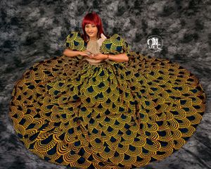 Dramatic overhead view of gold and navy patterned ball gown spread in circular pattern.
