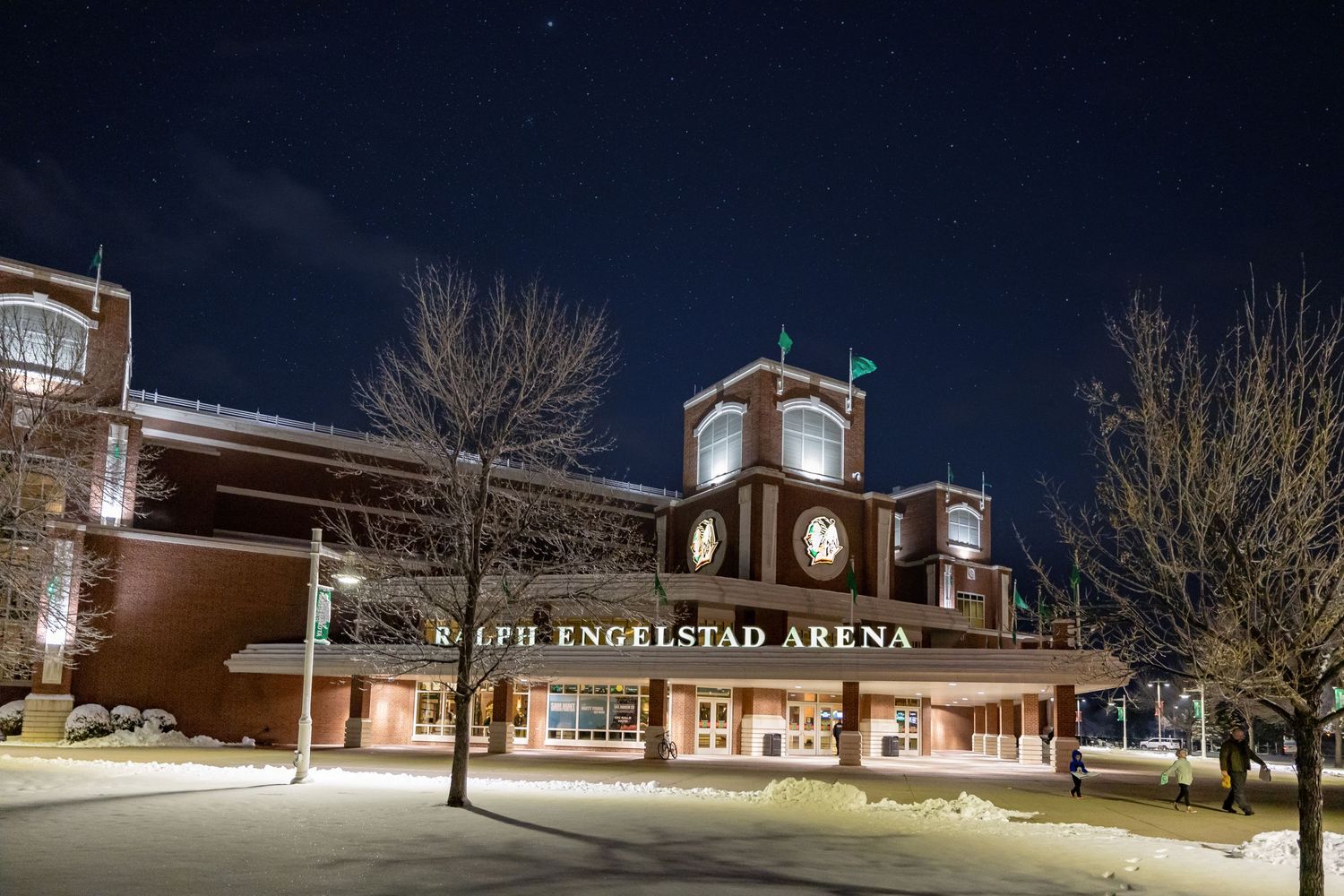 Exterior night view of Engstad Arena building with illuminated signage.