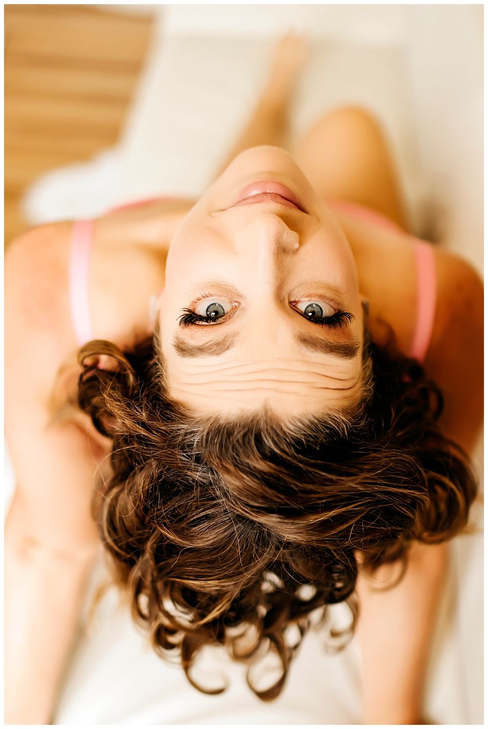 brunette leans back and looks up by San Diego Photographer