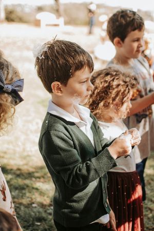 Group of children enjoying festivities at an outdoor celebration.