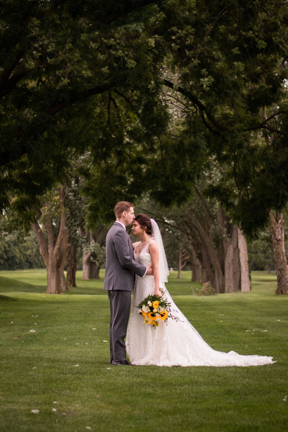 Bride and groom kissing at Stratford Country Club wedding