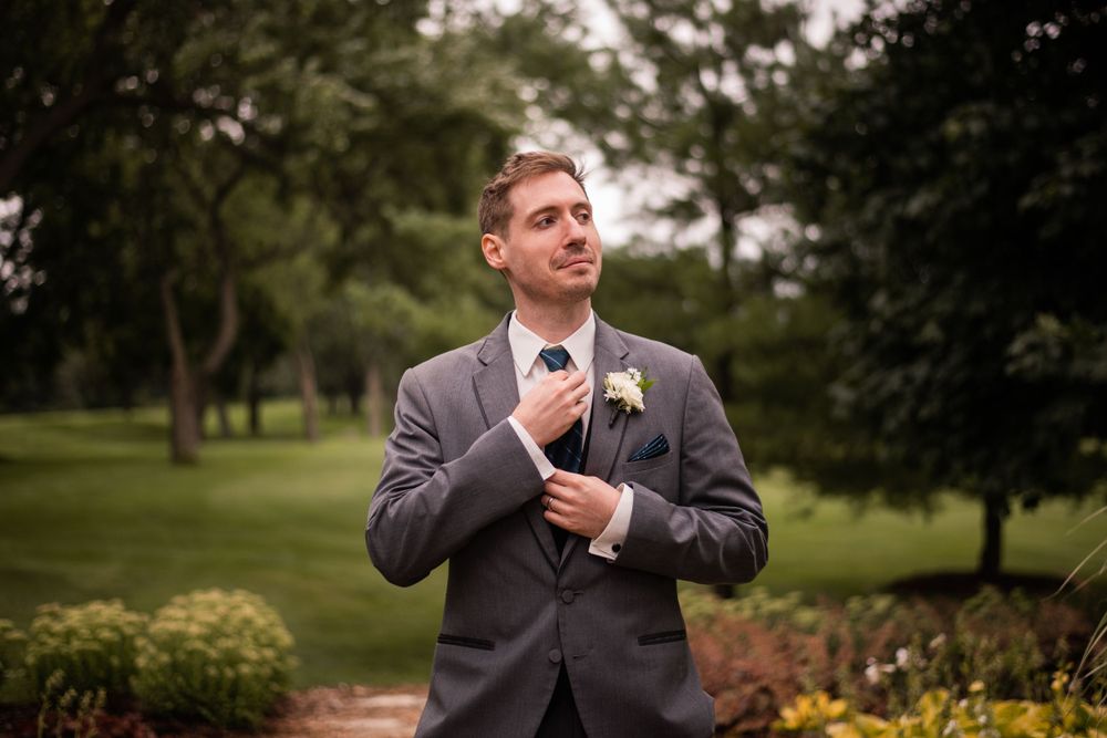 Groom portrait outdoors at Stratford Country Club wedding