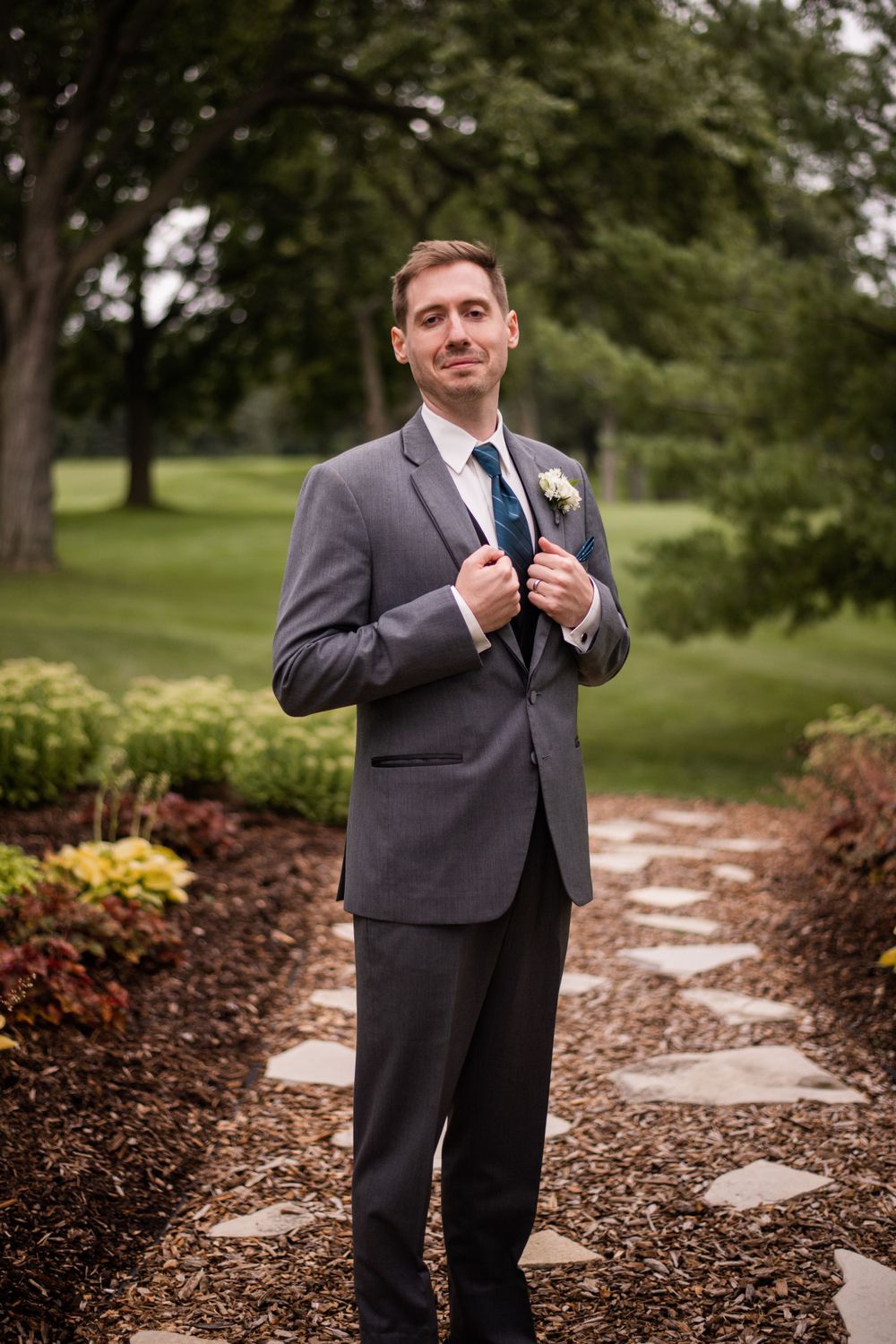 Groom portrait outdoors at Stratford Country Club wedding