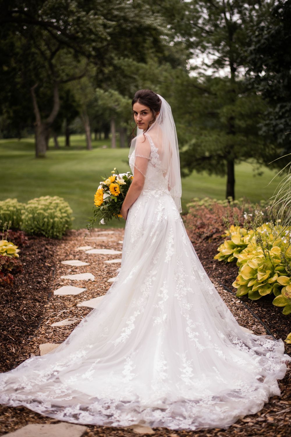 Bride portrait with bridal flower bouquet outdoors at Stratford Country Club wedding