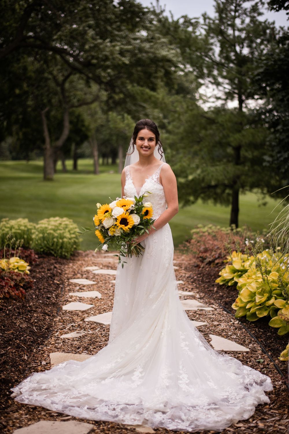 Bride portrait with bridal flower bouquet outdoors at Stratford Country Club wedding