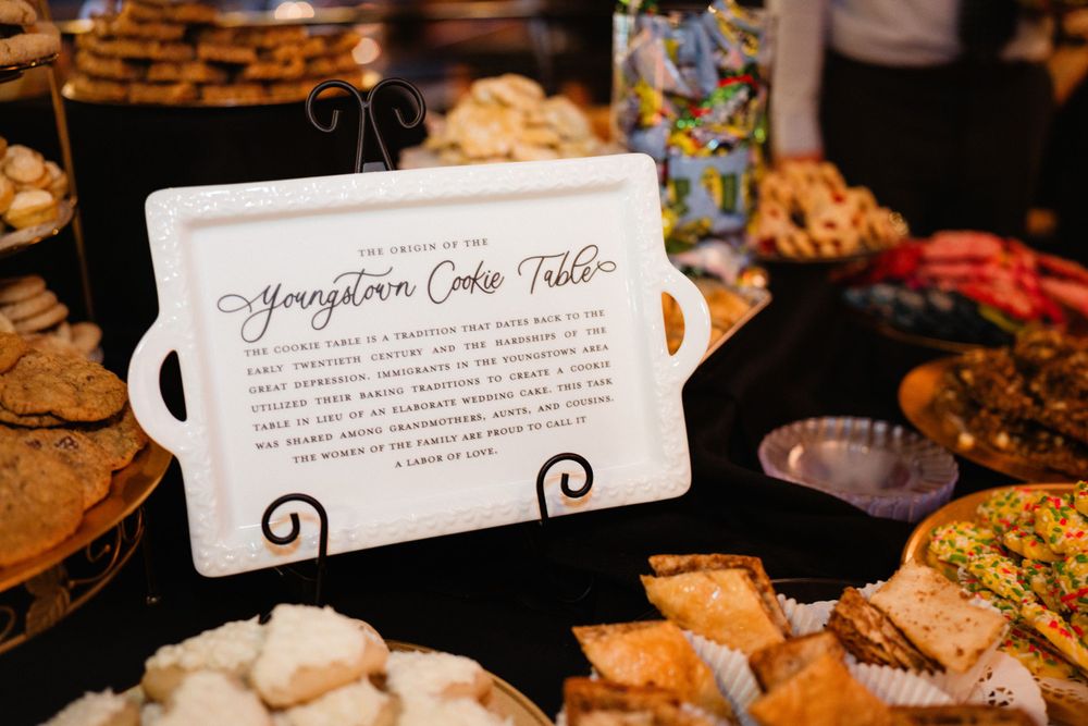 Appetizer display with description card at catered wedding event.