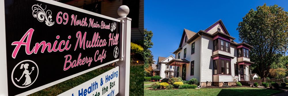 A sign for Annie Mullen's Bakery Cafe with a Victorian house in the background.