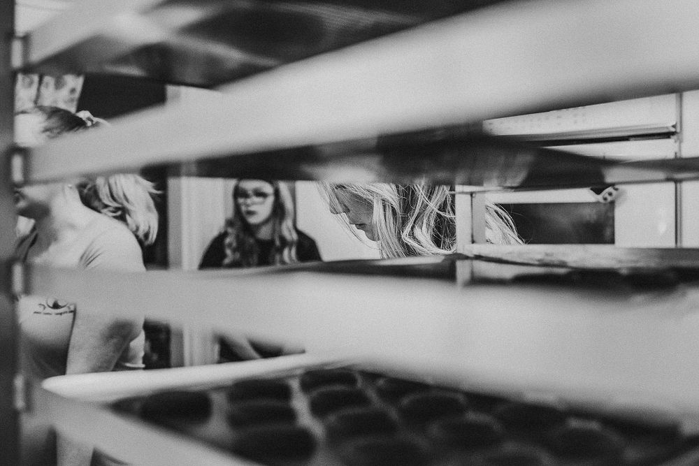 Abstract black and white view through bakery shelving.