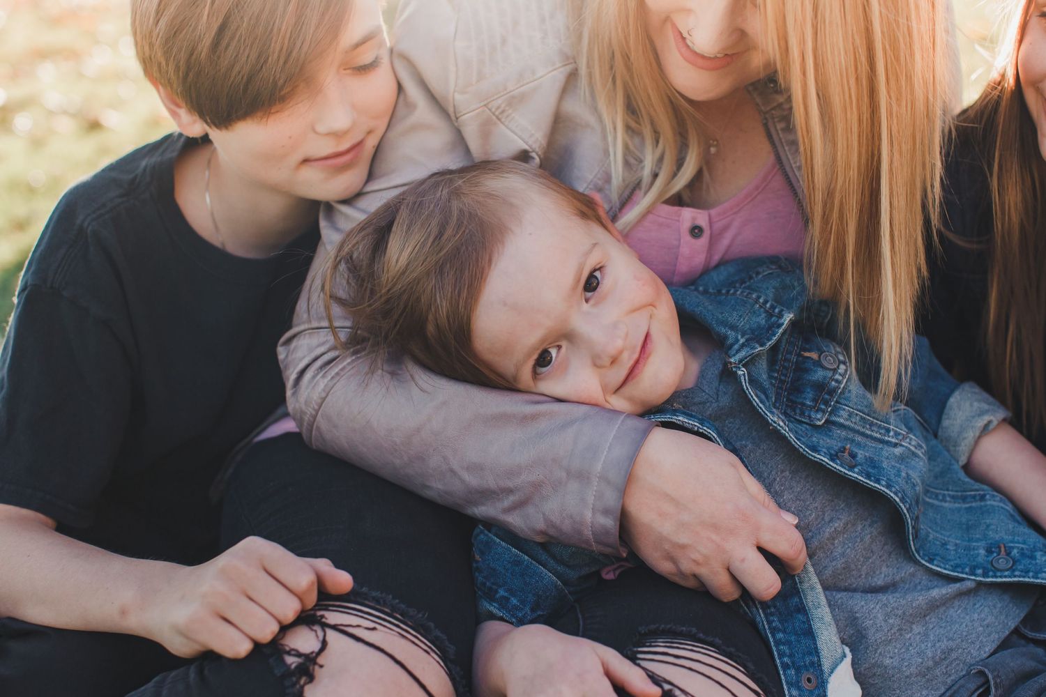 Mother hugging child during lifestyle family session Arizona