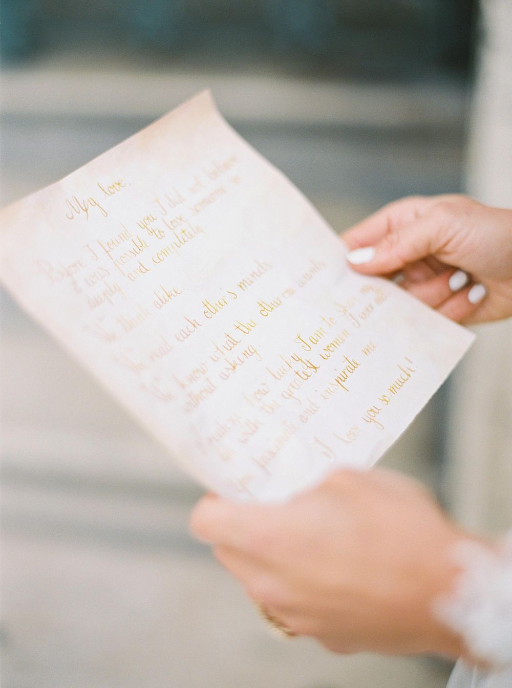 Bride holding wedding wows in Louvre, Paris - A heartfelt poem recited during a beautiful wedding ceremony.