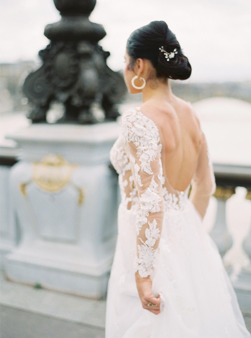 A chic bride posing for a wedding photoshoot in Paris.