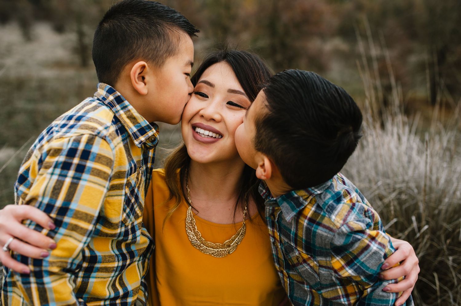 Joyful family moment captured outdoors during golden hour.