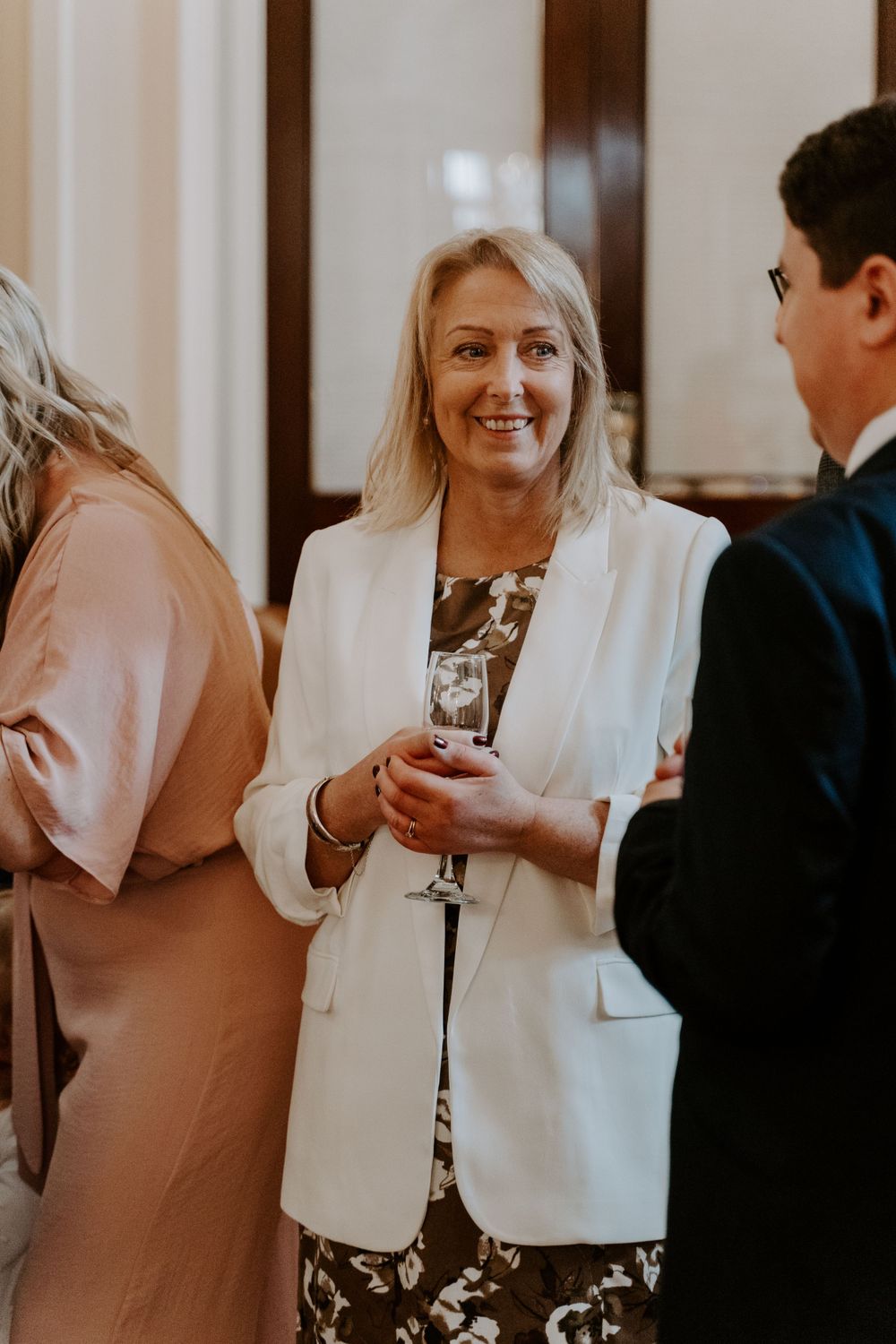A wedding guest mingling at the reception.