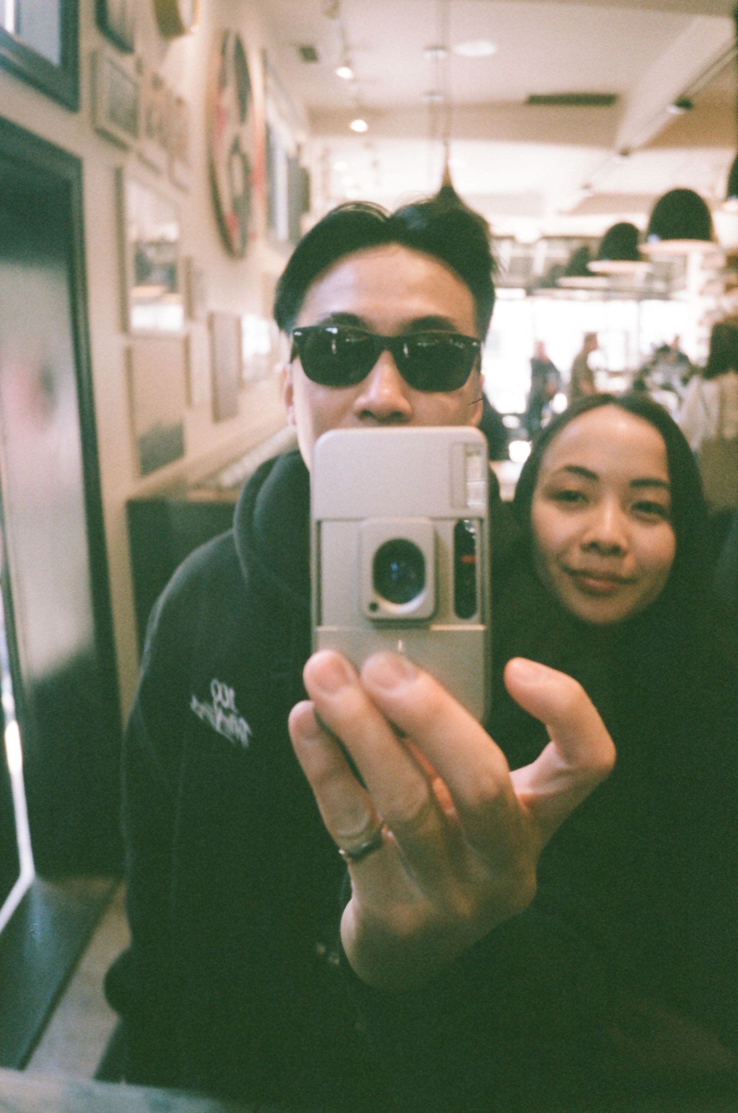Vintage-style mirror selfies taken in an indoor space with retro camera effects.