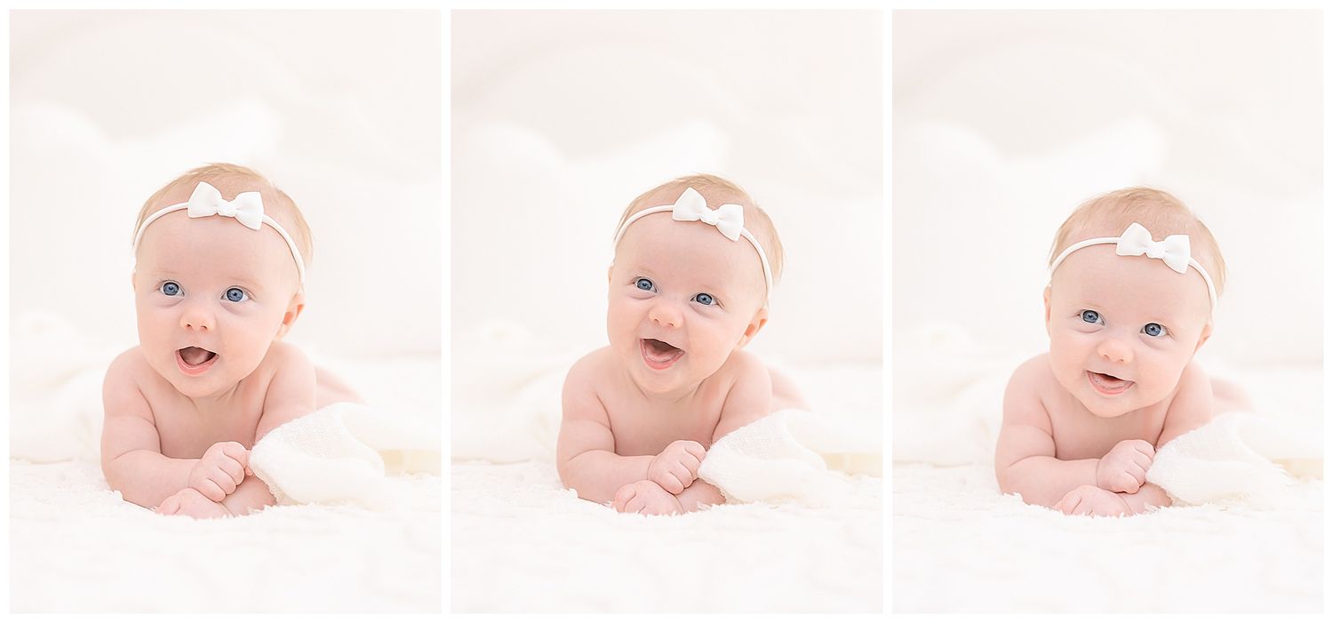 baby smiling laughing, white hair bow, white pillows, baby photographer chattanooga, newborn photogaphy, studio photo