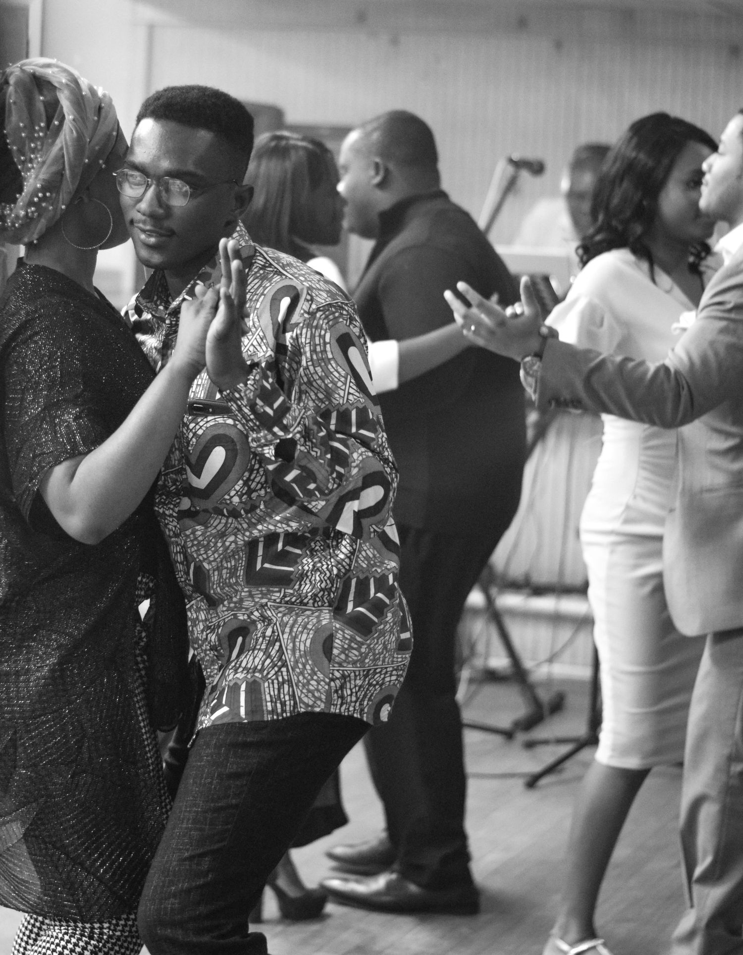 People dancing and socializing at what appears to be a party or social gathering.